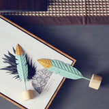 Gold-dipped Nordic Feathers [On A Wooden Base]